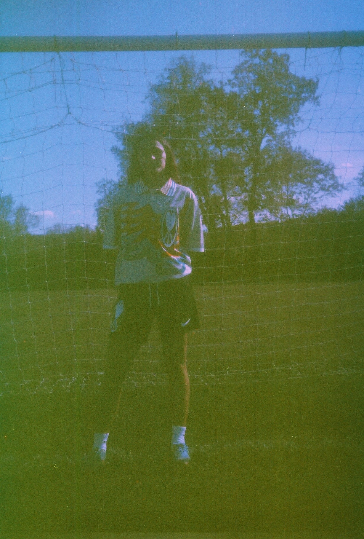 Unapologetic Youth UYFC home jersey, navy color with team logo, short sleeves, front view, sports apparel for soccer fans