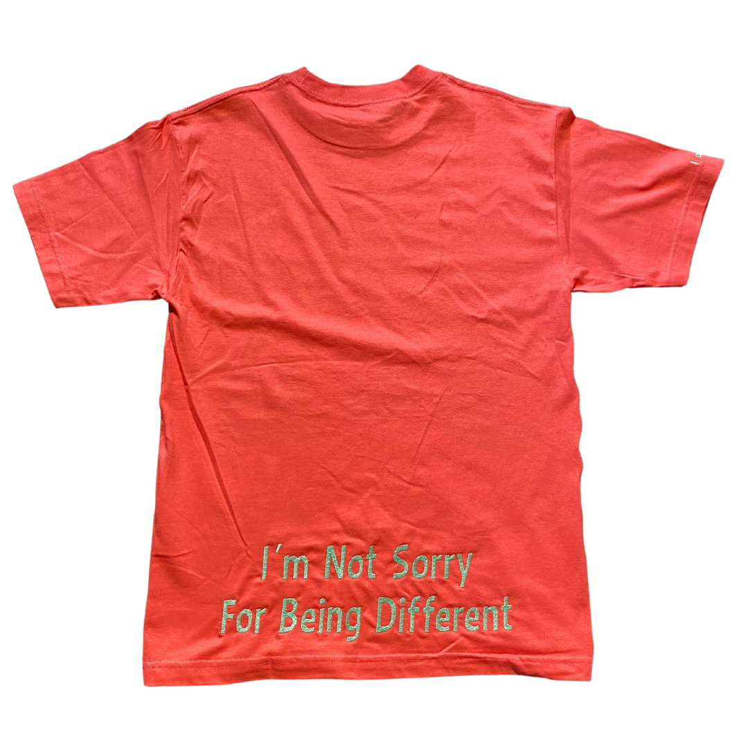 Hot pink Unapologetic Youth T-shirt with bold graphic design, casual fit, and short sleeves, on a plain background.
