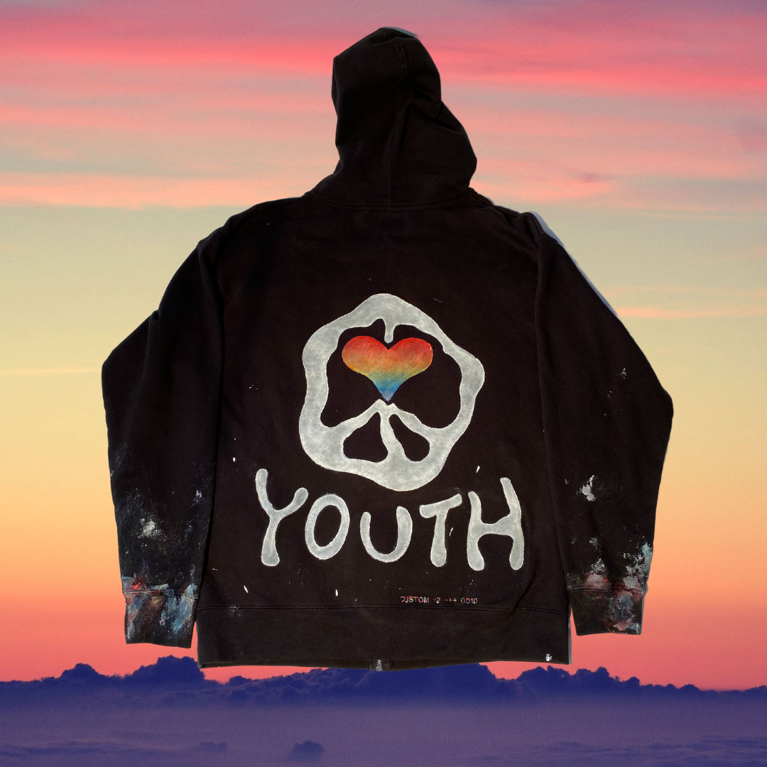 Unapologetic Youth hoodie in black, featuring a drawstring hood and front pocket, casual streetwear style.