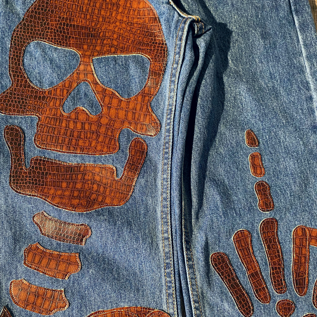 Unapologetic Youth "To The Bone" jeans, 1/1, showing distressed denim with frayed hems and classic five-pocket design.