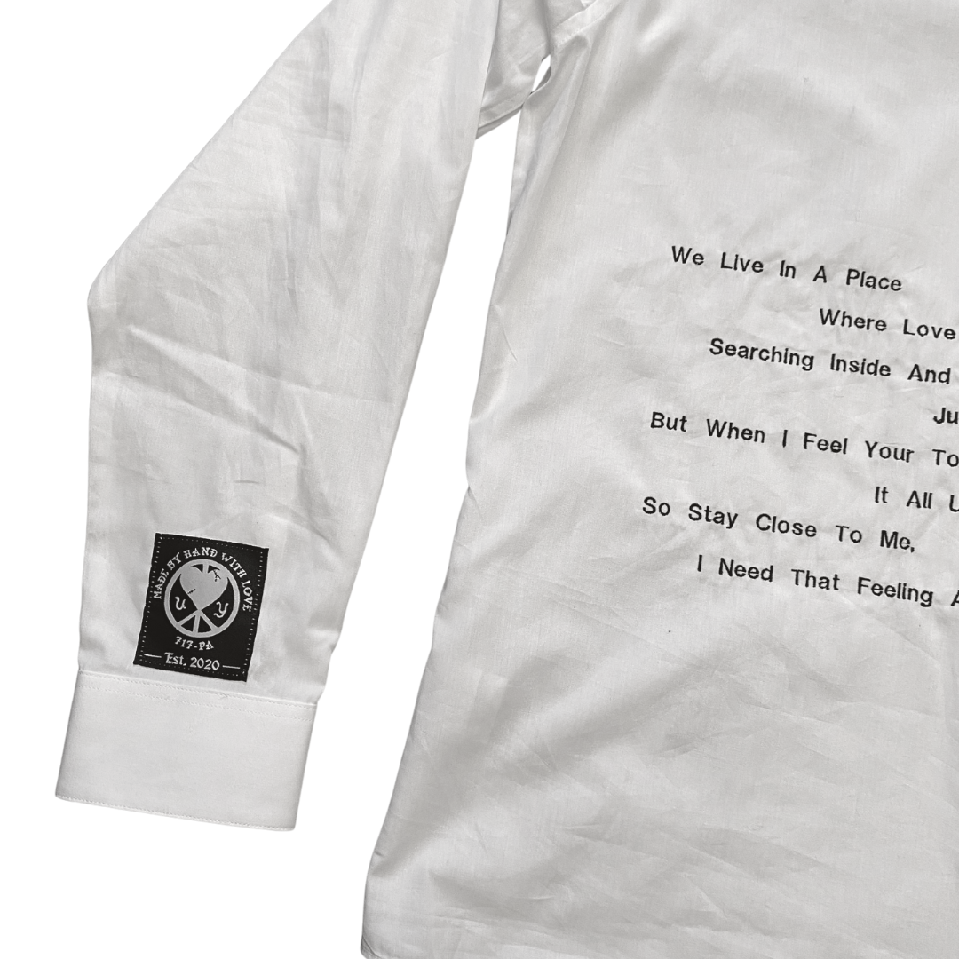 Three faces button-down shirt by Unapologetic Youth featuring a colorful face print on soft fabric.