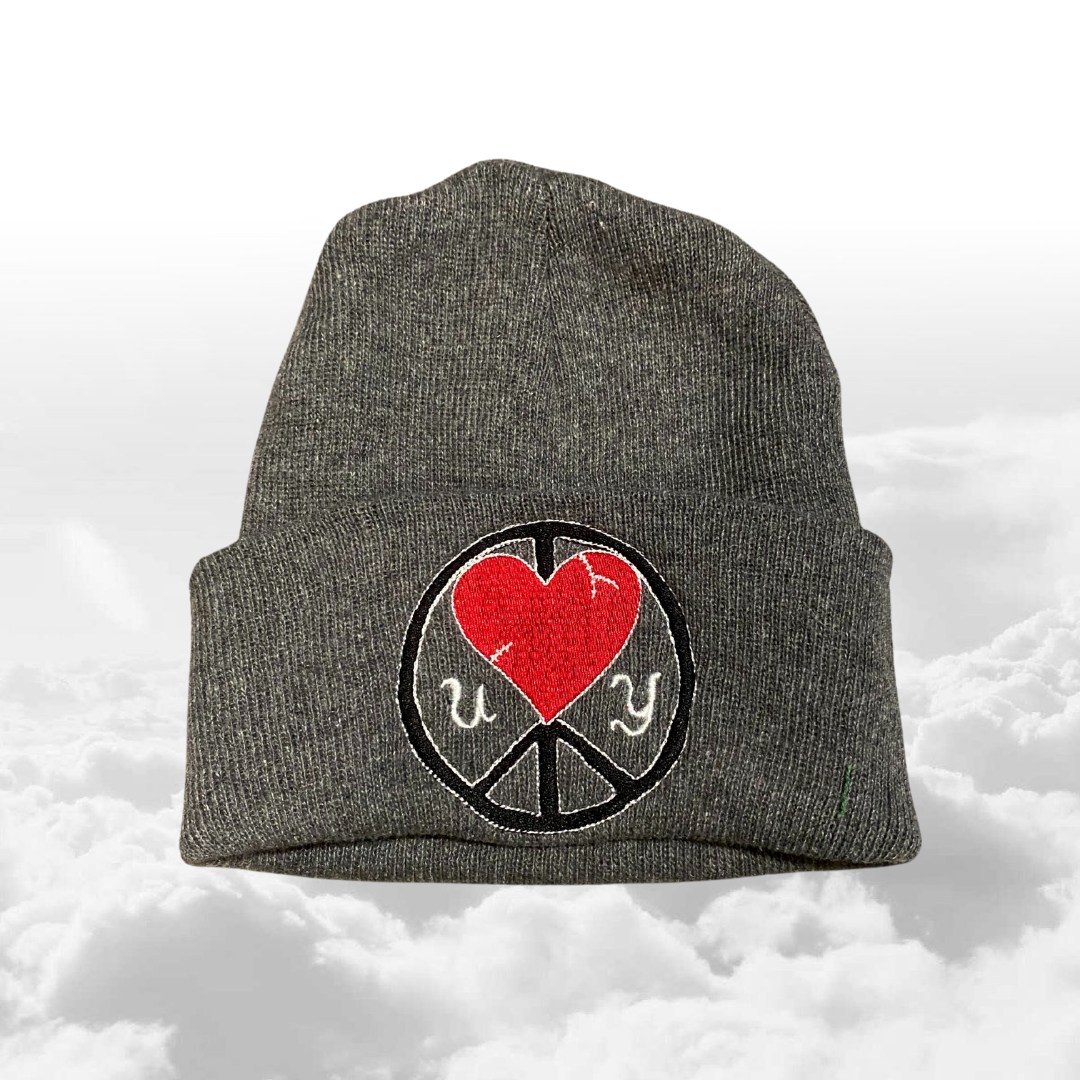 Unapologetic Youth UY Logo Beanie in black with white embroidered brand logo, cozy knit winter hat for cold weather.