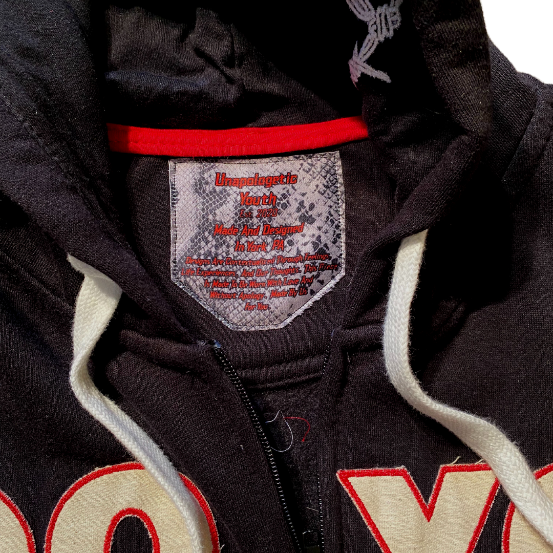 Unapologetic Youth Always & Forever large zip-up hoodie in black with front pockets and adjustable drawstrings.