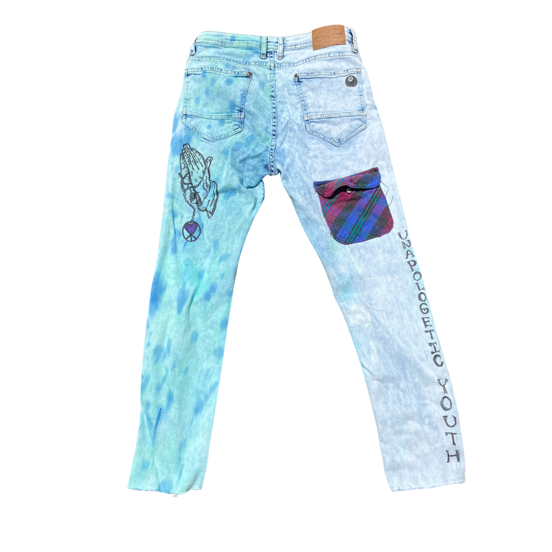 Unapologetic Youth Keep Us Ever Mindful jeans with classic fit and distressed denim, displayed on a neutral background.