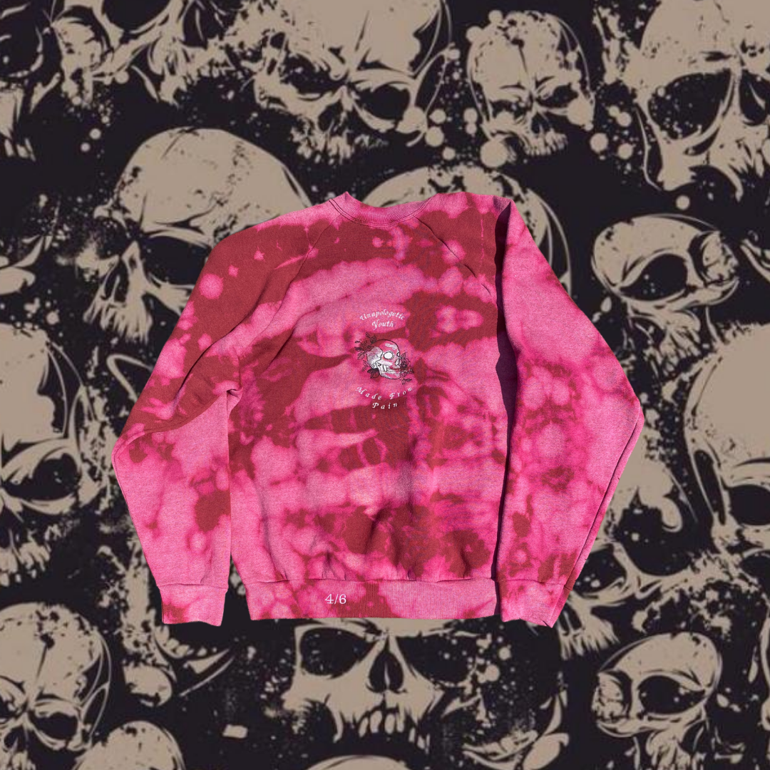 Unapologetic Youth crewneck sweatshirt featuring a bold pain graphic design on the front, casual and comfortable streetwear style