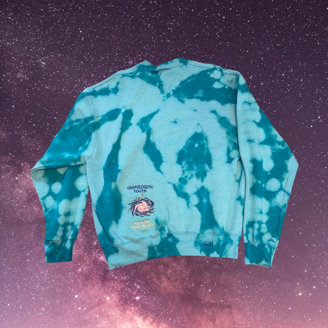 Unapologetic Youth Spaced Out crewneck sweatshirt with space-themed graphic on light-colored fabric.