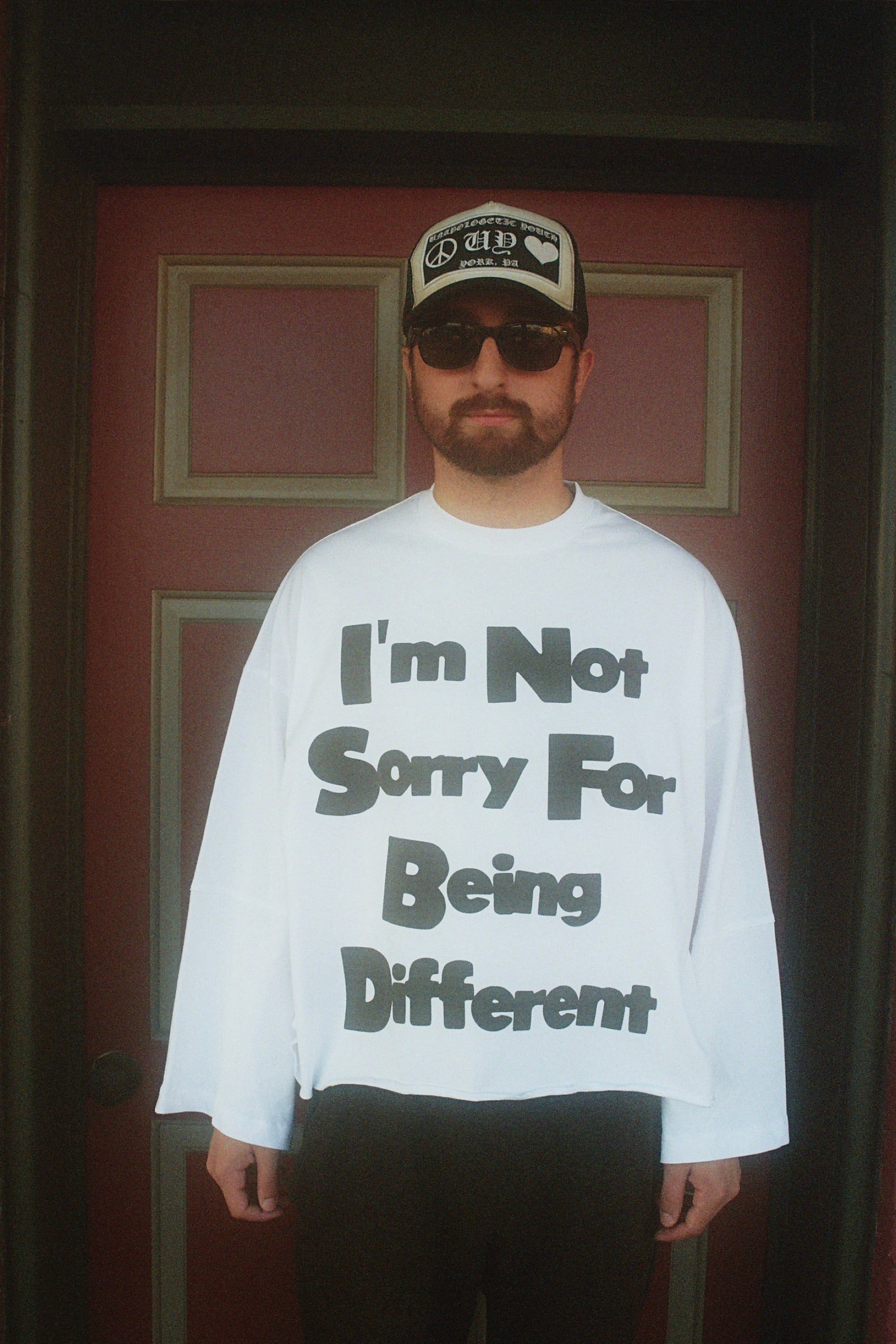 Unapologetic Youth flared long sleeve shirt in black, featuring a relaxed fit with wide sleeves and a casual style.