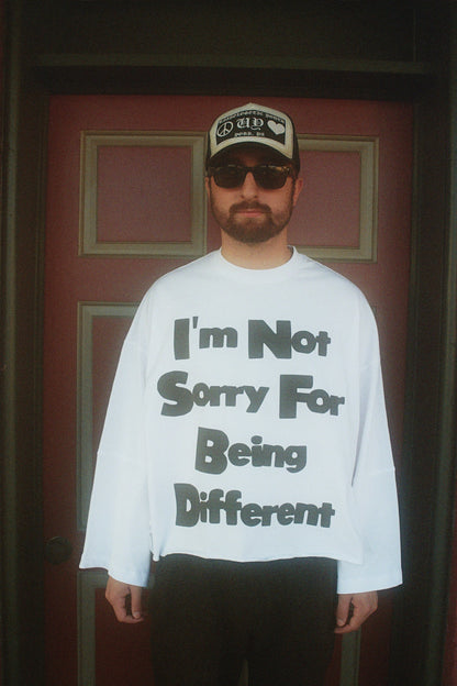 Unapologetic Youth flared long sleeve shirt in black, featuring a relaxed fit with wide sleeves and a casual style.