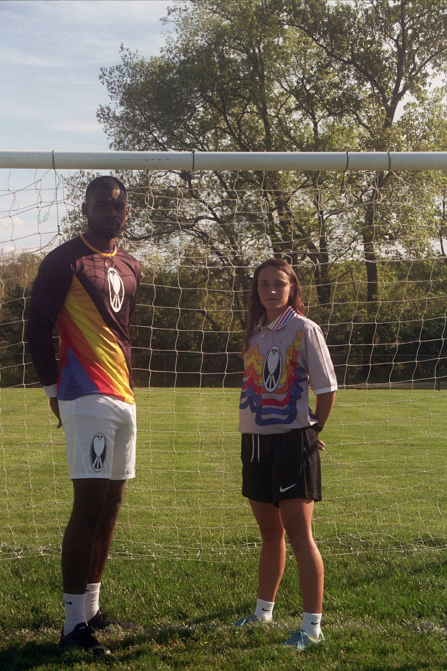 Unapologetic Youth UYFC Home jersey, navy and white design, featuring team logo and athletic fit, displayed on a hanger.