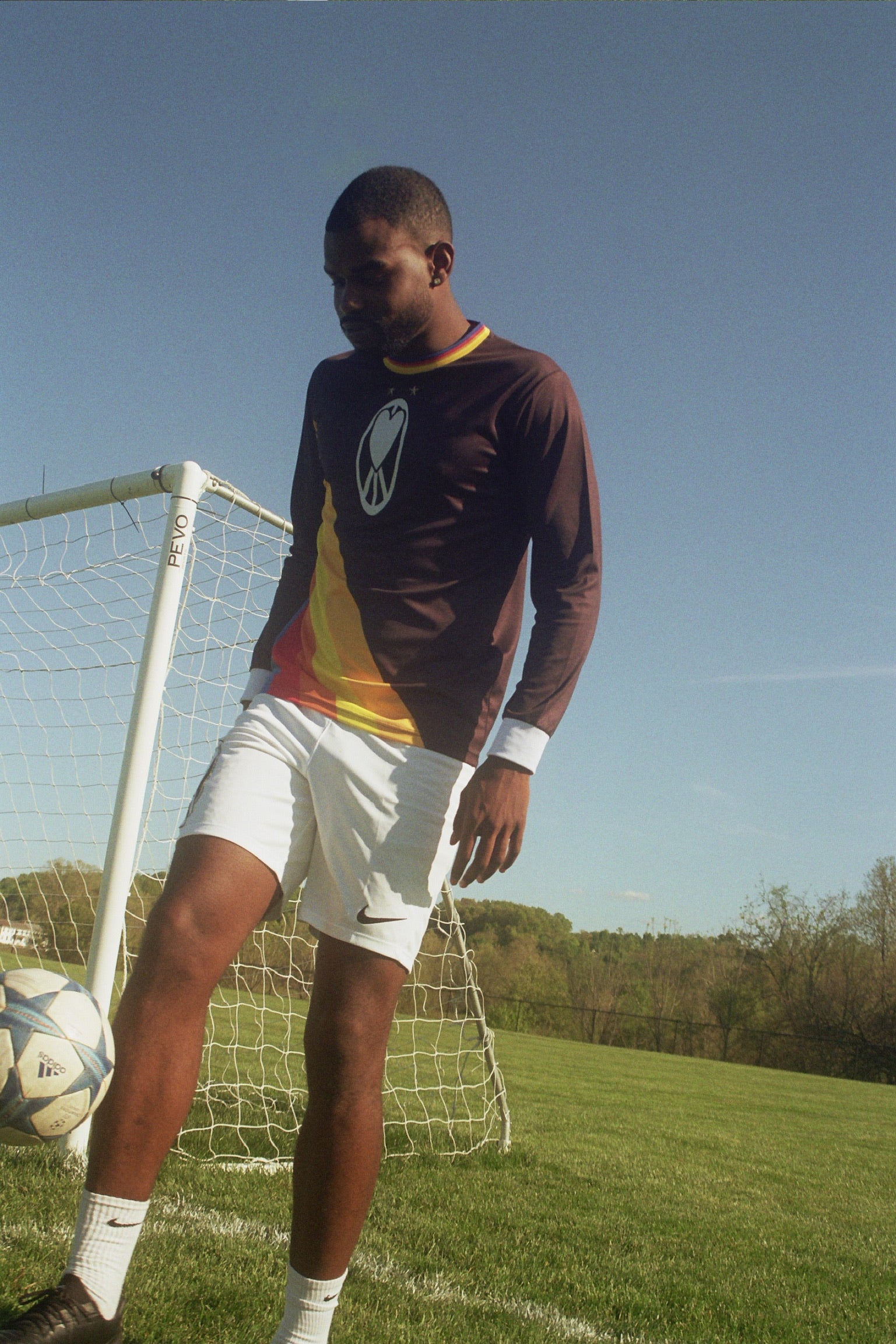 Unapologetic Youth UYFC Away jersey displayed on a hanger with team logos and blue and white color design.