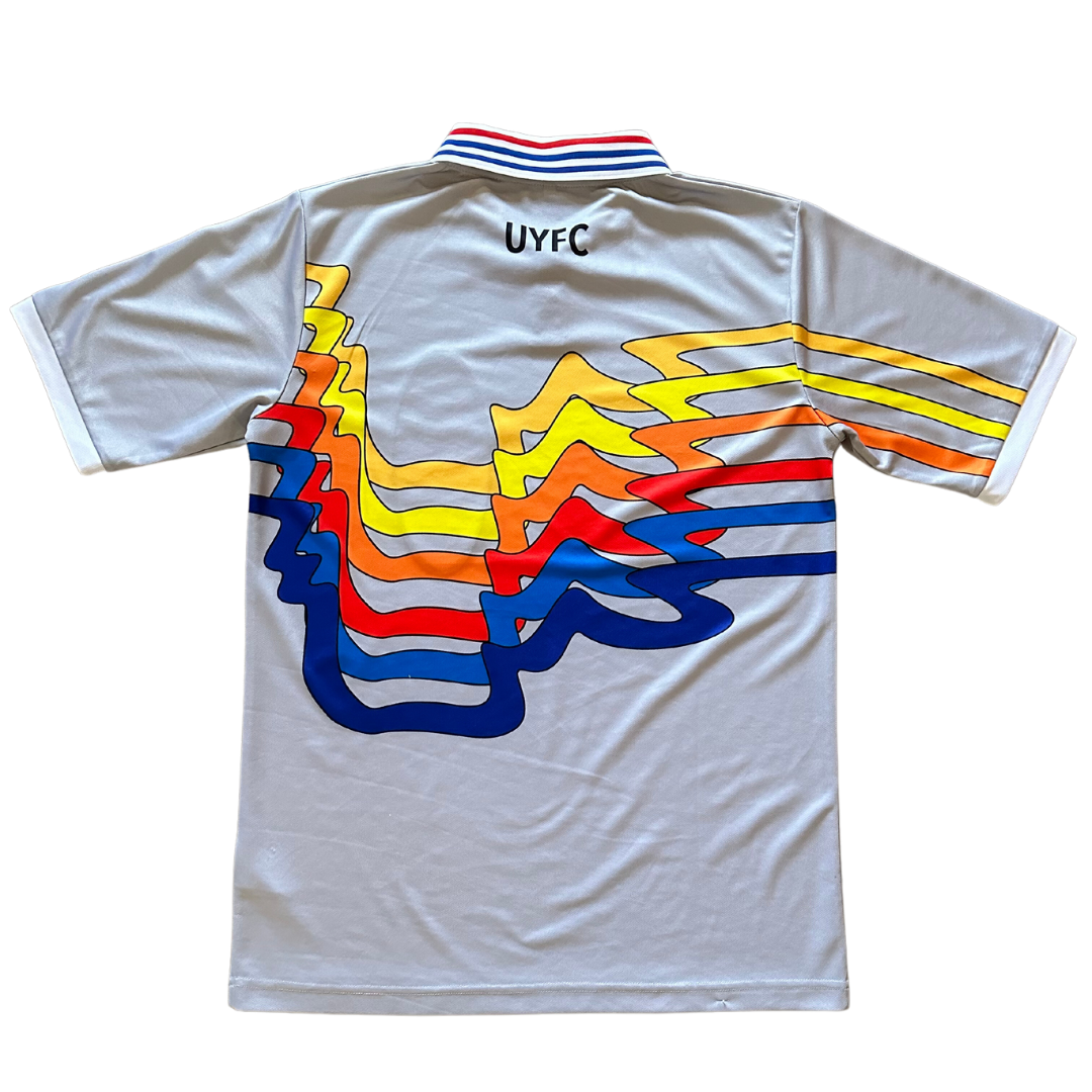 Unapologetic Youth UYFC home jersey with team logo and design, displayed on a flat surface.