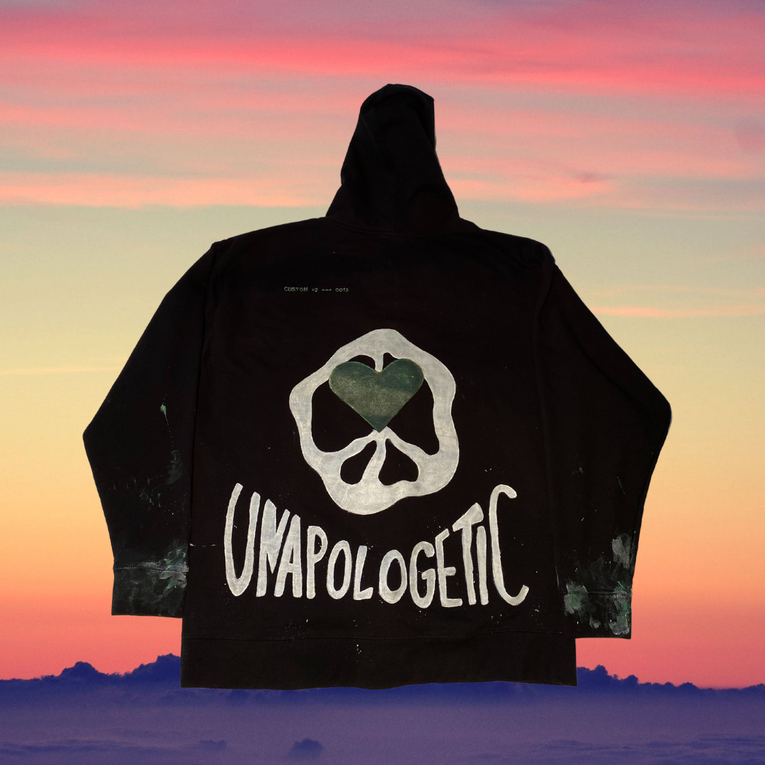 Black Unapologetic Youth hoodie with front pocket and drawstring hood, casual streetwear style for everyday wear.