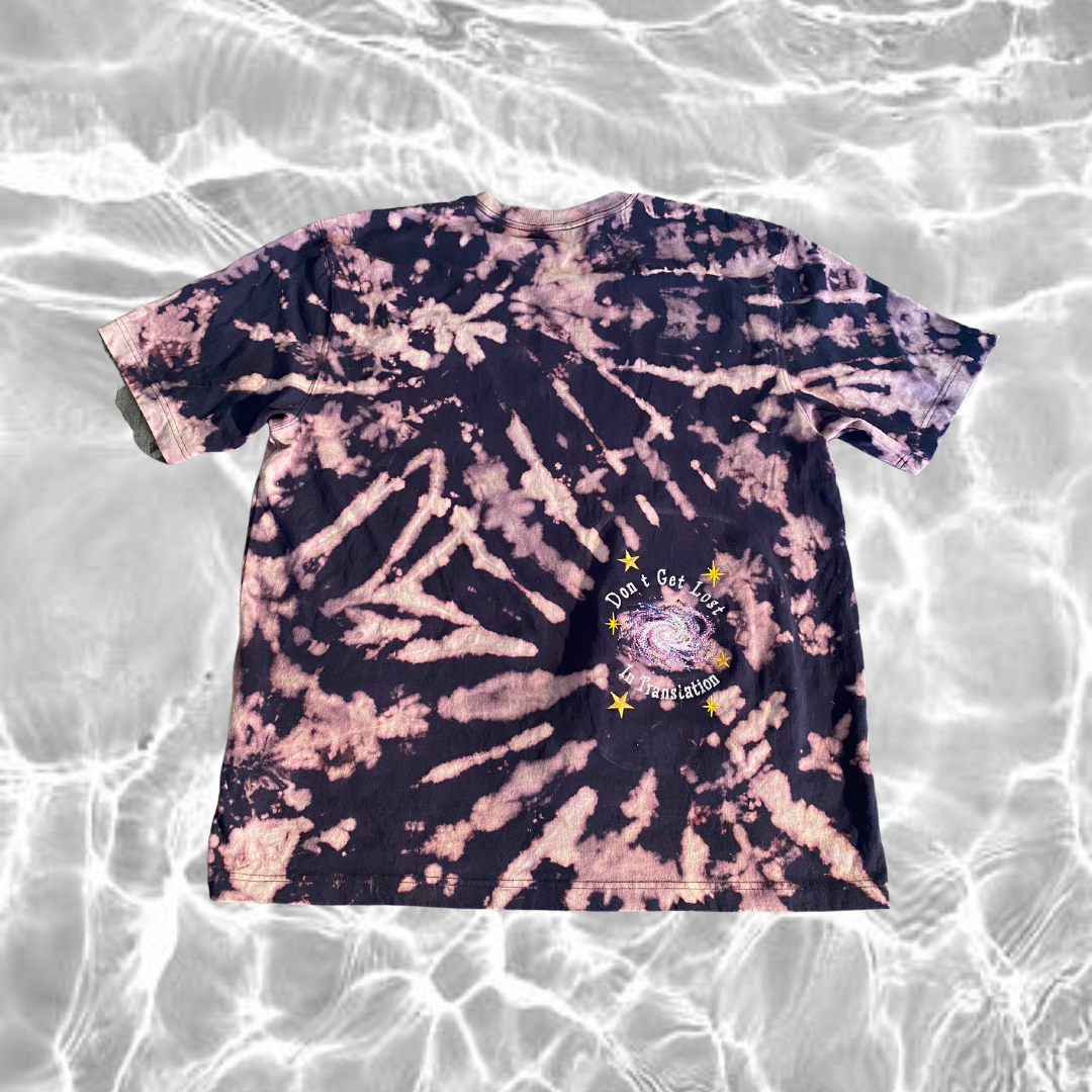 Unapologetic Youth x Carhartt Star Shine T-shirt featuring a graphic design on a black cotton fabric.