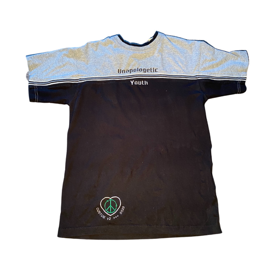 Unapologetic Youth T-Shirt with bold graphic design, casual fit, and soft fabric, displayed on a mannequin.
