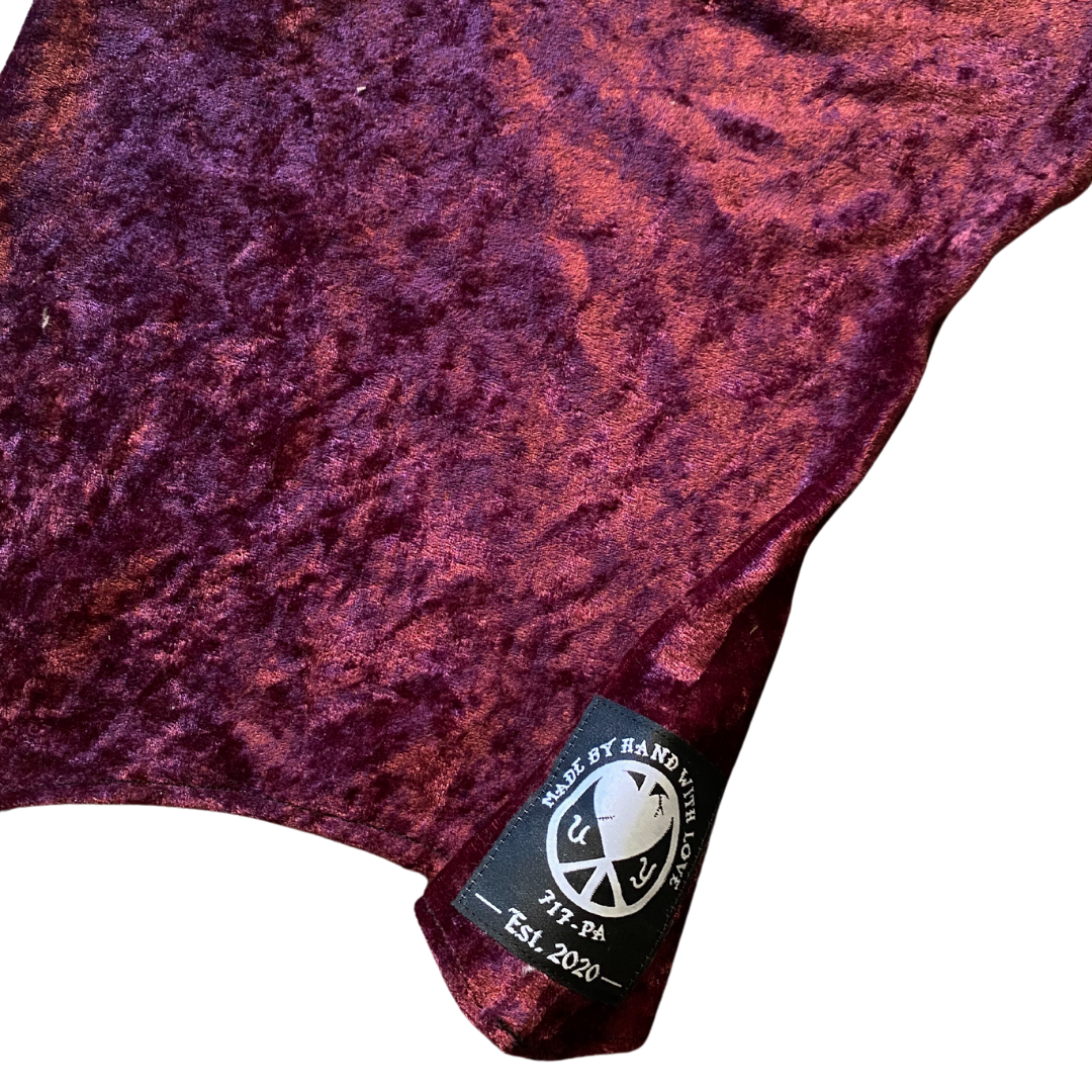 Unapologetic Youth balaclava in black, close-up view showing snug fit and stretchy fabric for cold weather protection.