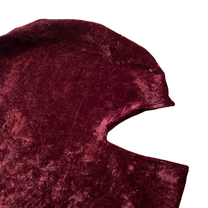 Unapologetic Youth balaclava in black, close-up view showing the snug fit and stretchy fabric for cold weather protection.