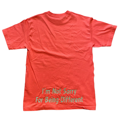 Hot pink Unapologetic Youth T-shirt with bold graphic design, casual fit, and short sleeves, on a plain background.