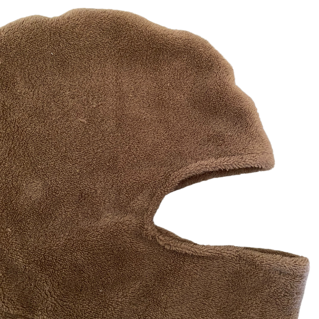 Unapologetic Youth black balaclava with a snug fit, made from breathable fabric for outdoor winter activities.