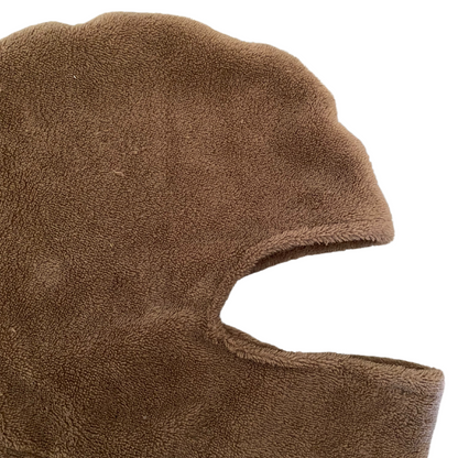 Unapologetic Youth black balaclava with a snug fit, made from breathable fabric for outdoor winter activities.