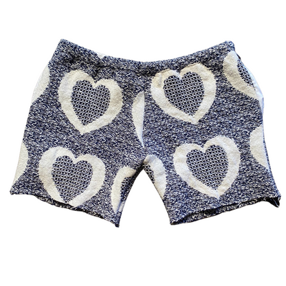 Unapologetic Youth Love Me v1 shorts in black, featuring a relaxed fit and stylish design, displayed on a plain background.