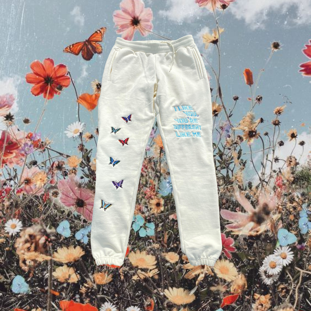 Unapologetic Youth Butterfly Effect sweatpants featuring butterfly graphic print, comfortable fit, and casual streetwear style.