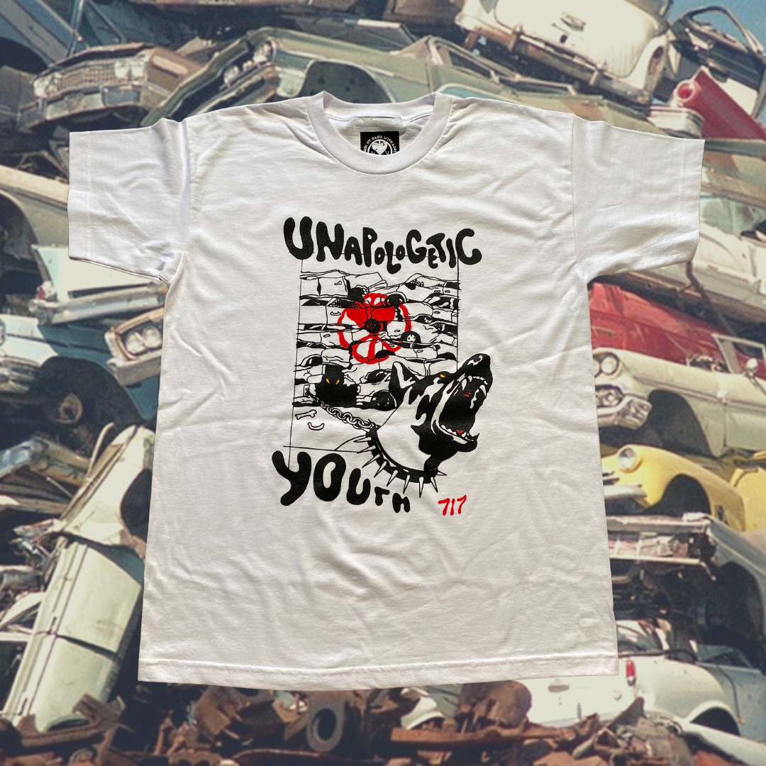 Unapologetic Youth Junkyard T-shirt featuring a graphic print of a scrapyard scene on soft cotton fabric.