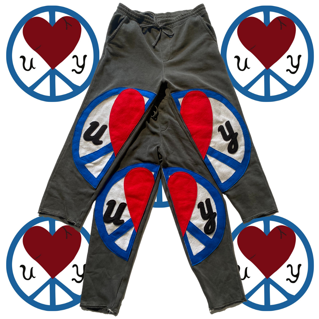 Unapologetic Youth Split Logo sweatpants featuring a stylish logo design on soft, comfortable casual joggers.