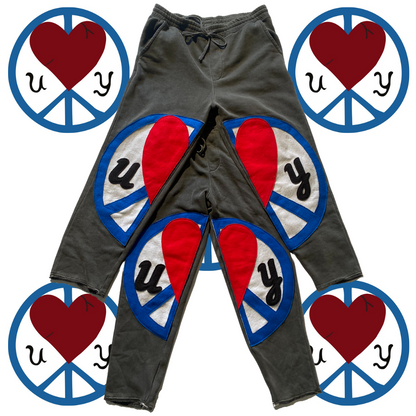 Unapologetic Youth Split Logo sweatpants featuring a stylish logo design on soft, comfortable casual joggers.