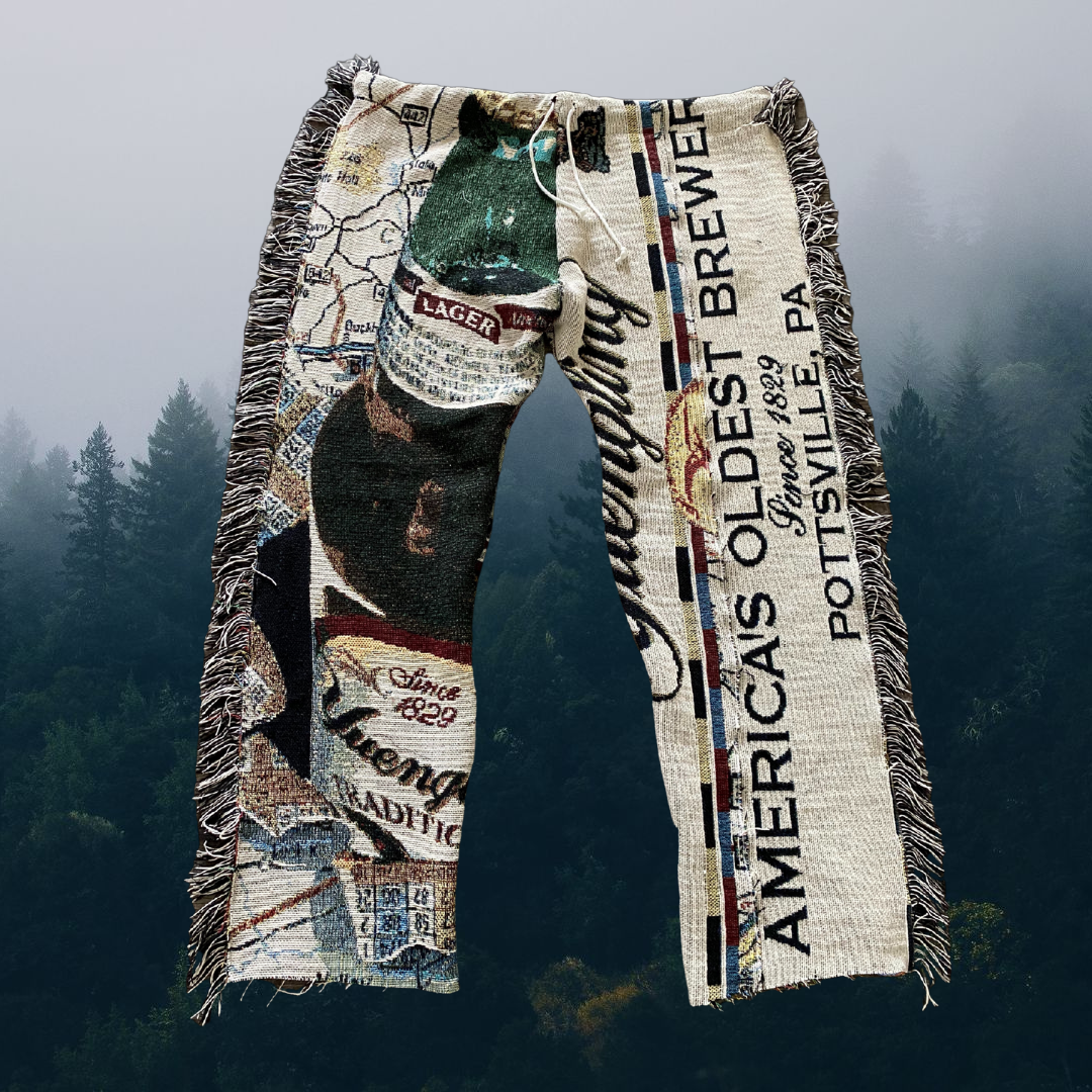 Unapologetic Youth woven pants featuring a Yuengling logo print, casual style with comfortable fabric and detailed design.