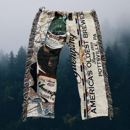 Unapologetic Youth woven pants featuring a Yuengling logo print, casual style with comfortable fabric and detailed design.