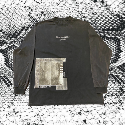 Unapologetic Youth hi-definition long sleeve shirt with bold design, black fabric, and fitted style displayed on a mannequin.