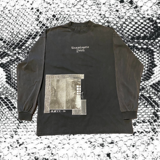 Unapologetic Youth hi-definition long sleeve shirt with bold design, black fabric, and fitted style displayed on a mannequin.