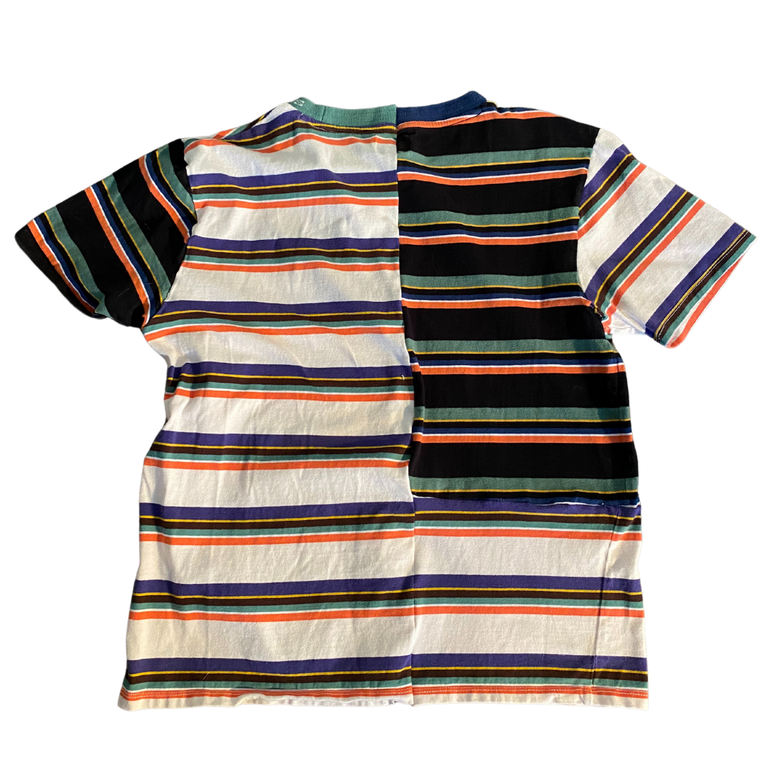 Unapologetic Youth x Guess graphic T-shirt featuring bold design, casual fit, and short sleeves, displayed on a hanger.