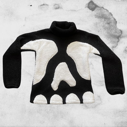 Unapologetic Youth Spooky v1 fleece hoodie featuring a dark, eerie design with ghostly and spooky elements.