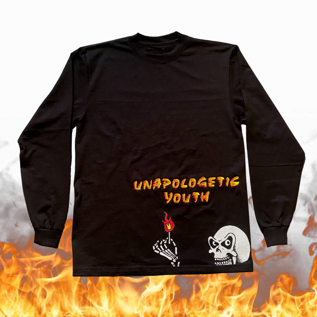Unapologetic Youth long sleeve shirt titled "Ignite The Flame" featuring bold flame graphic design on black fabric.