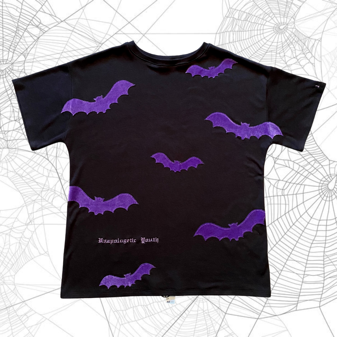 Unapologetic Youth Spooky V2 T-Shirt featuring dark, spooky graphic design on black fabric.