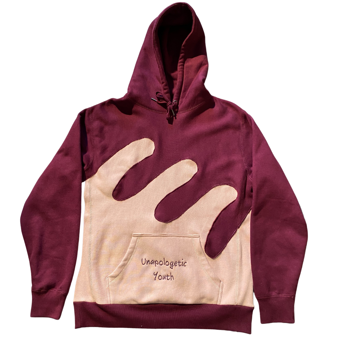 Unapologetic Youth Waves hoodie showing a close-up of the fabric and design in a casual, stylish fit.