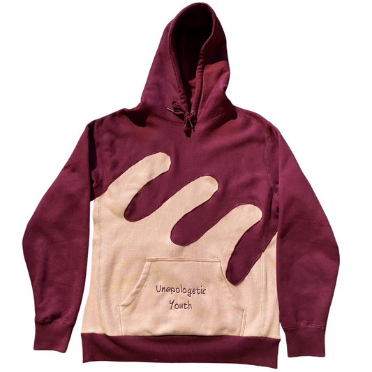 Unapologetic Youth Waves hoodie showing a close-up of the fabric and design in a casual, stylish fit.