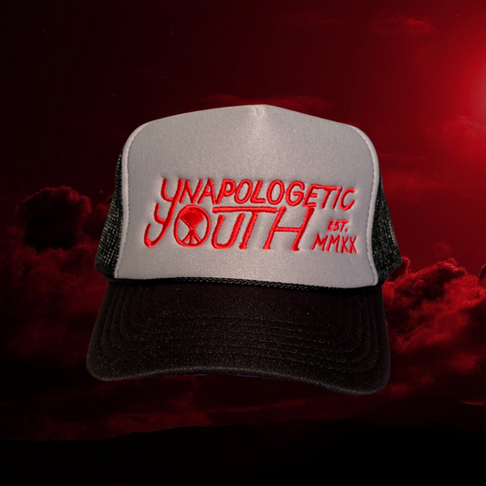 Unapologetic Youth Logo Trucker hat with embroidered branding on front panel, adjustable snapback, and mesh back for breathability.