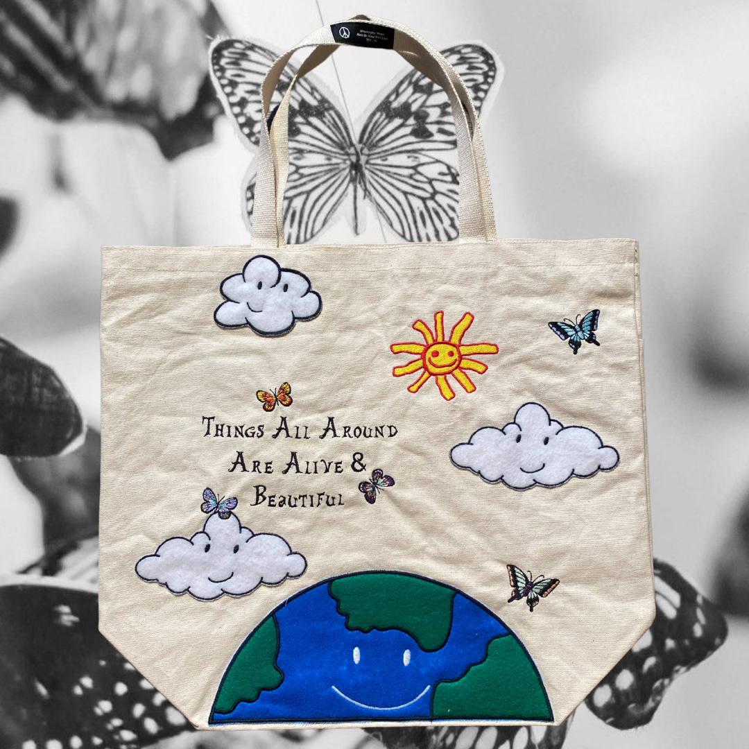 Unapologetic Youth Mother Nature tote bag with earthy green leaf design and sturdy fabric, perfect for eco-friendly shopping.