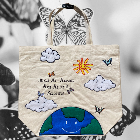 Unapologetic Youth Mother Nature tote bag with earthy green leaf design and sturdy fabric, perfect for eco-friendly shopping.
