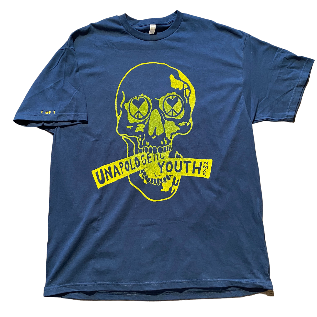 Navy blue Unapologetic Youth T-shirt displayed flat showing front design and fabric texture.