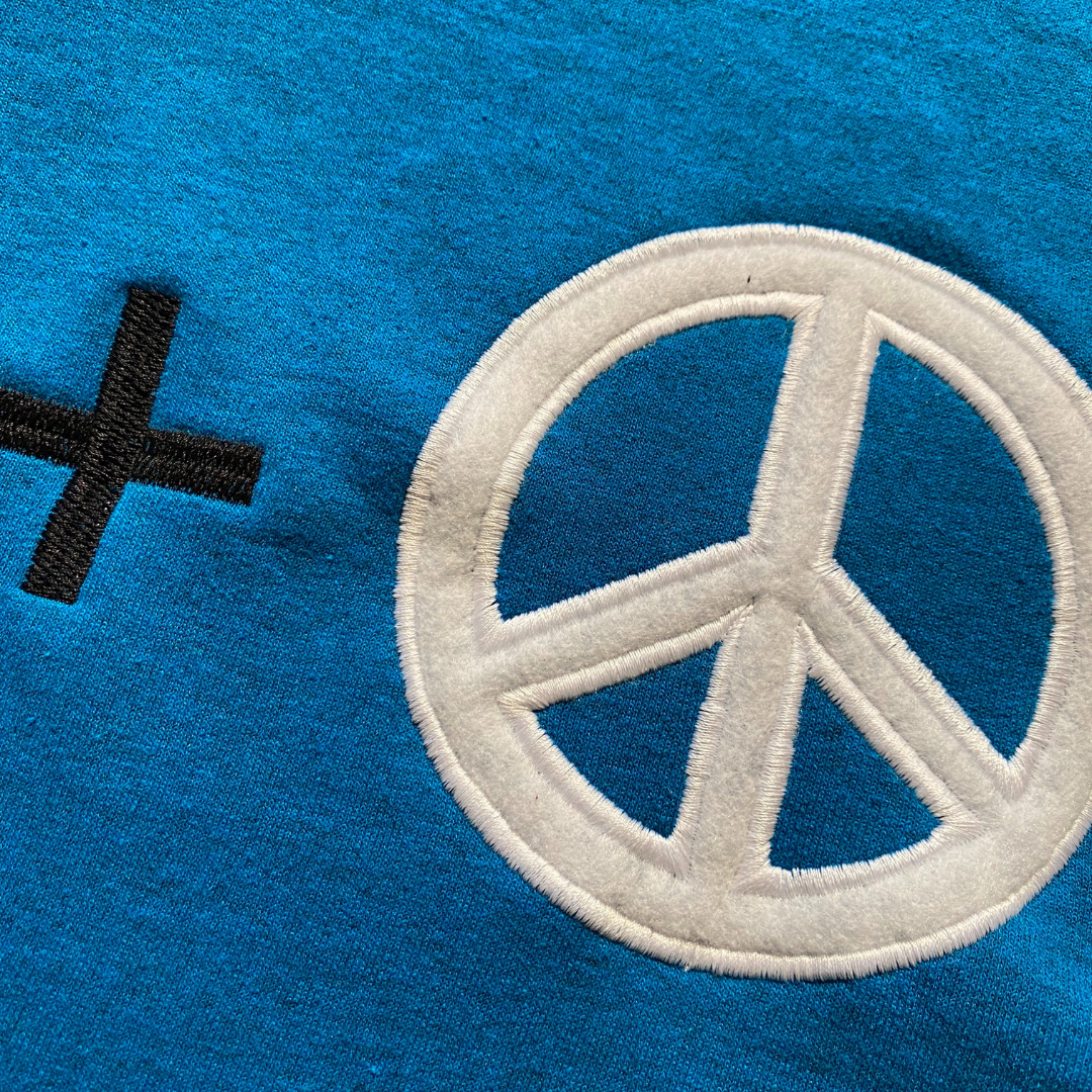 Unapologetic Youth Peace + Love 2XL hoodie with colorful graphic design on front, casual streetwear style, front view.