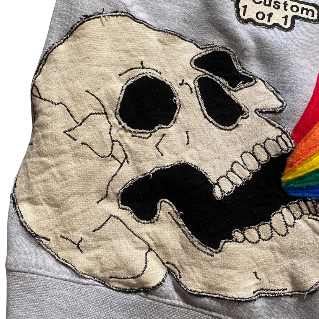 Unapologetic Youth Light Beams large hoodie featuring a bold graphic design in black and white, shown on a hanger.