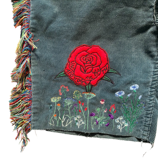 Unapologetic Youth Rose Meadow shorts featuring a floral pattern with pink and green hues on lightweight fabric.