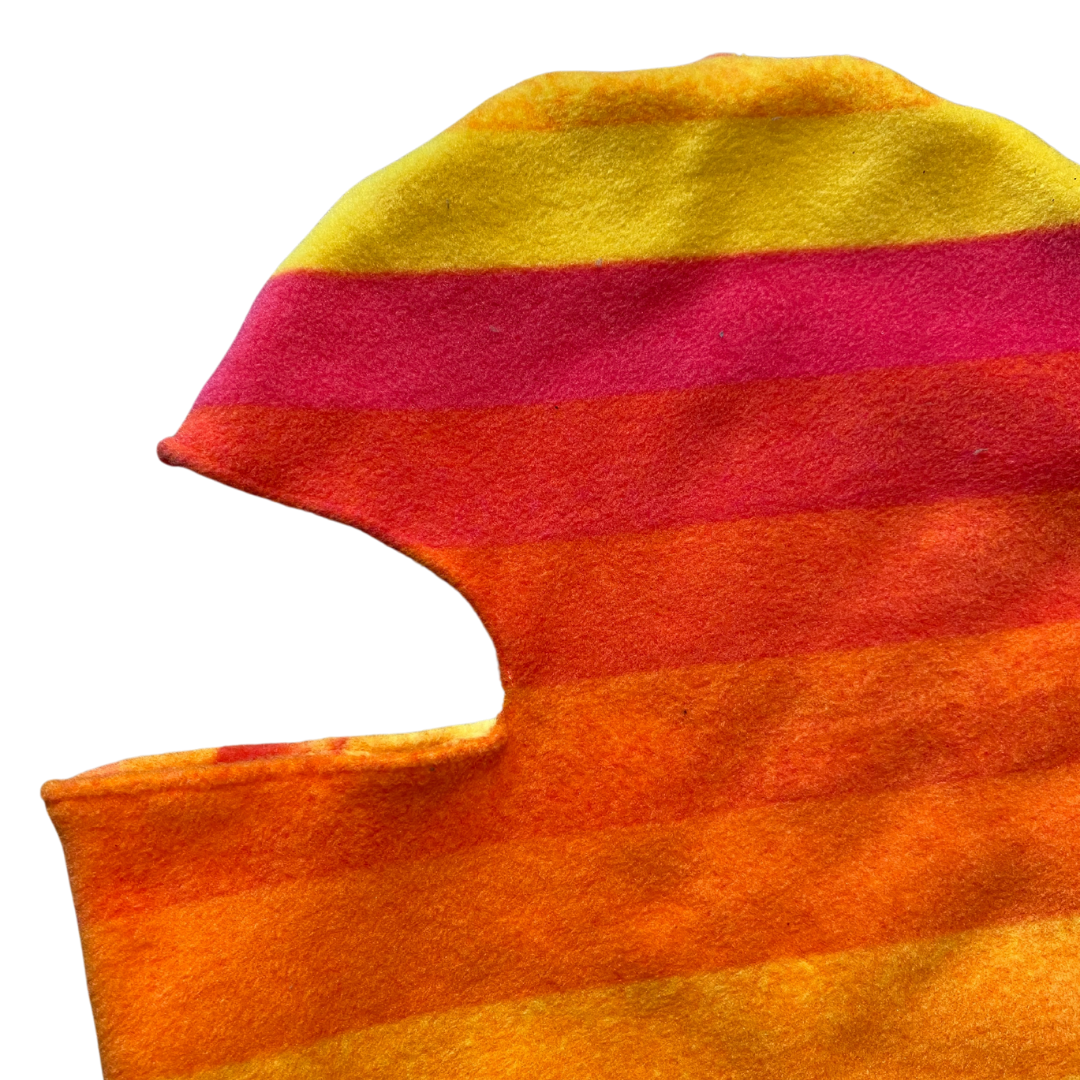 Unapologetic Youth black balaclava covering the head and neck, made of soft, stretchy fabric for warmth and comfort.