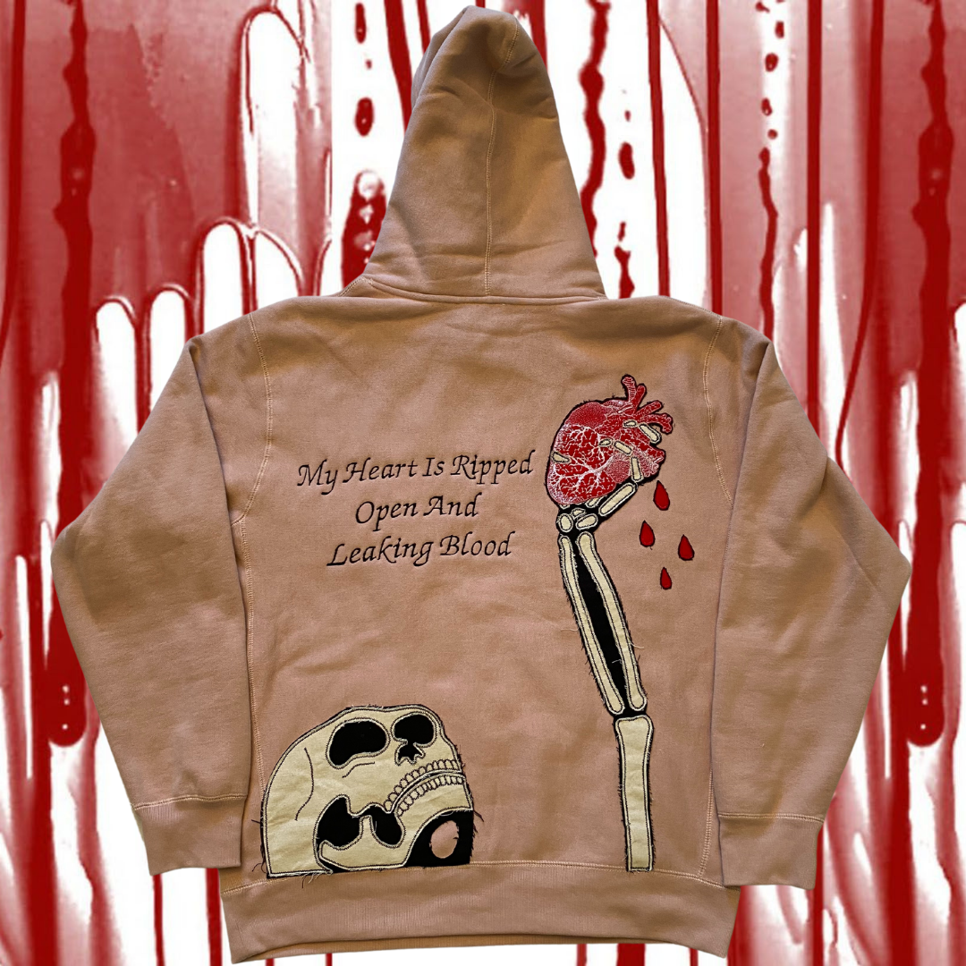 Unapologetic Youth Bleeding Love hoodie featuring a graphic design with red and black artwork on soft fabric.