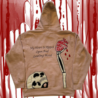 Unapologetic Youth Bleeding Love hoodie featuring a graphic design with red and black artwork on soft fabric.