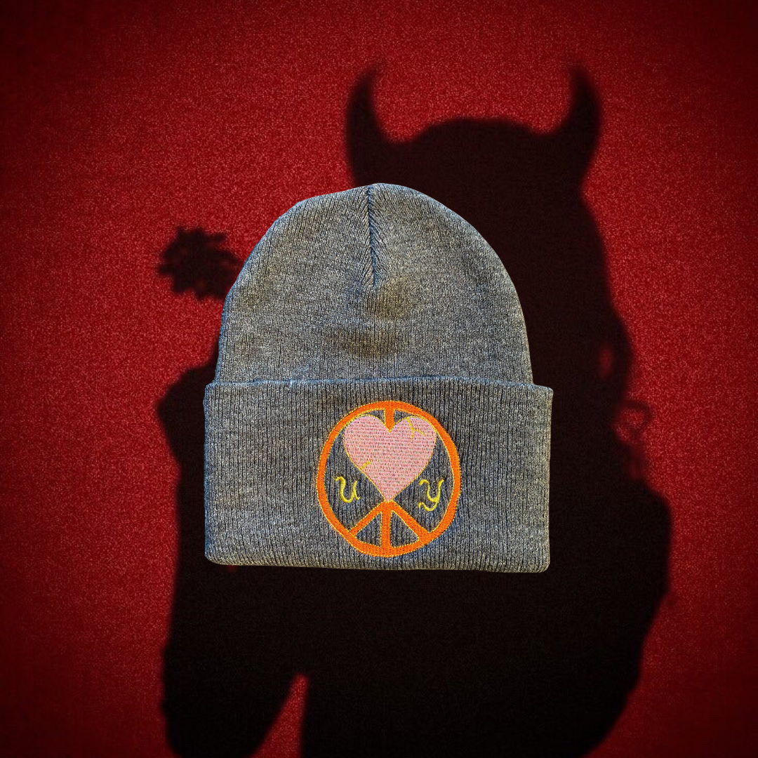 Gray "Cold World" beanie by Unapologetic Youth featuring a soft knit fabric and stylish design.