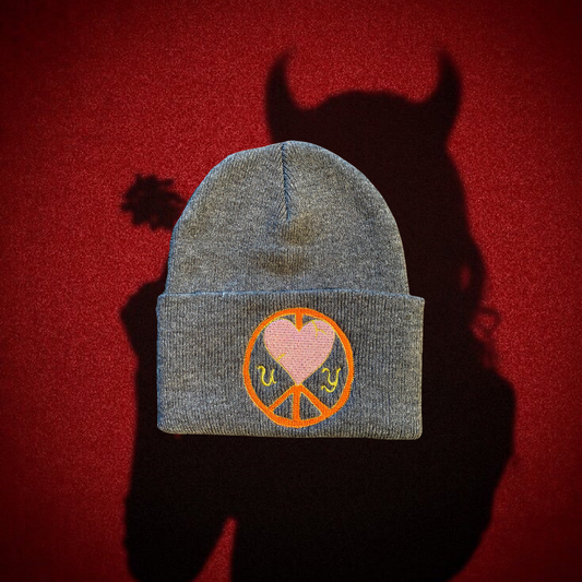 Gray "Cold World" beanie by Unapologetic Youth featuring a soft knit fabric and stylish design.